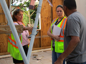 Inspectors helping disaster survivor